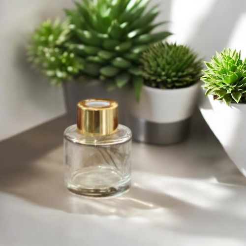 Parfumflesje transparant rond met gouden, zilveren of zwarte dop – €2,08/st – set van 12